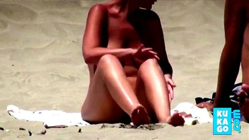 Nude blonde wife on beach